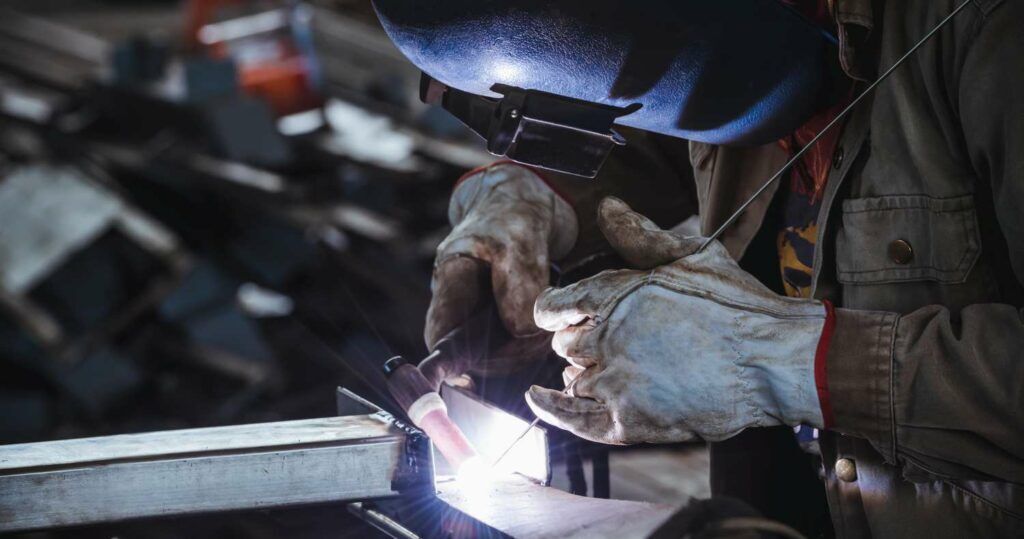 Industrial welder welding fabricated stainless construction work in factory, Welding process by Gas Tungsten Arc Welding