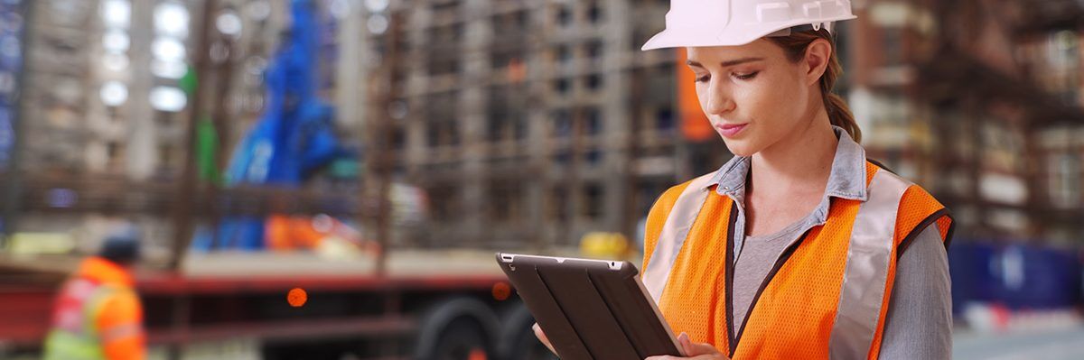 Worker looking on tablet with LMS