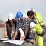 Construction engineers discuss and share feedback on the job.