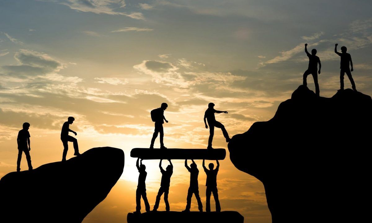 Group of people on peak mountain climbing helping team work , tr