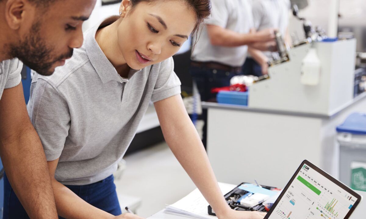 Employee preparing for fieldwork by reviewing digital safety procedures, showcasing how EHS and LMS systems support confident, compliant workers.