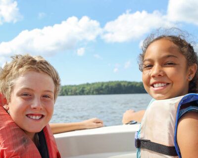 children safety enjoying boating on a lake