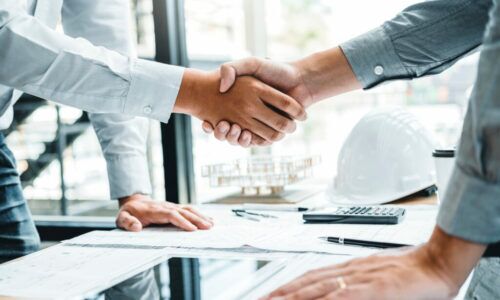 Engineer handshake meeting for architectural project and working