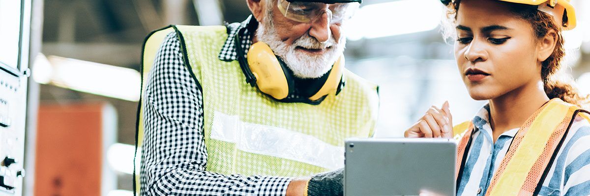 two people looking over safety on the ipad