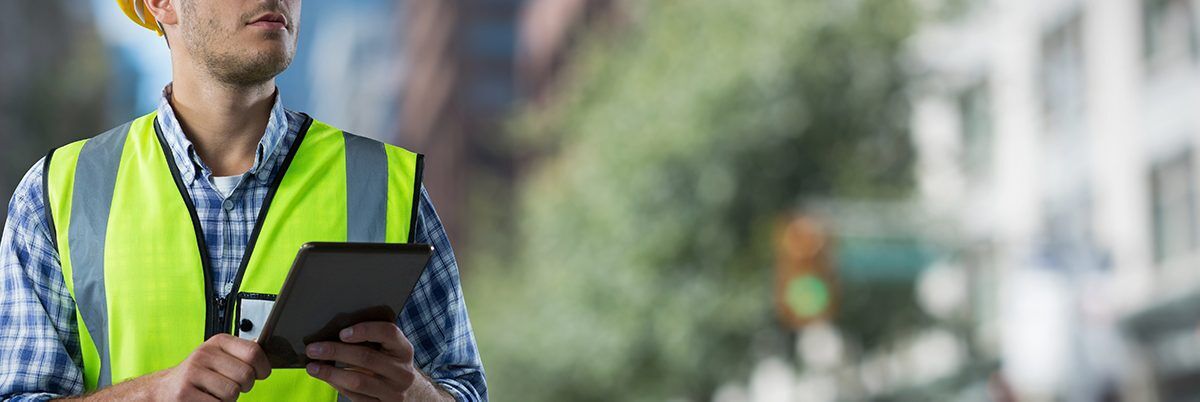 person on tablet for equipment management