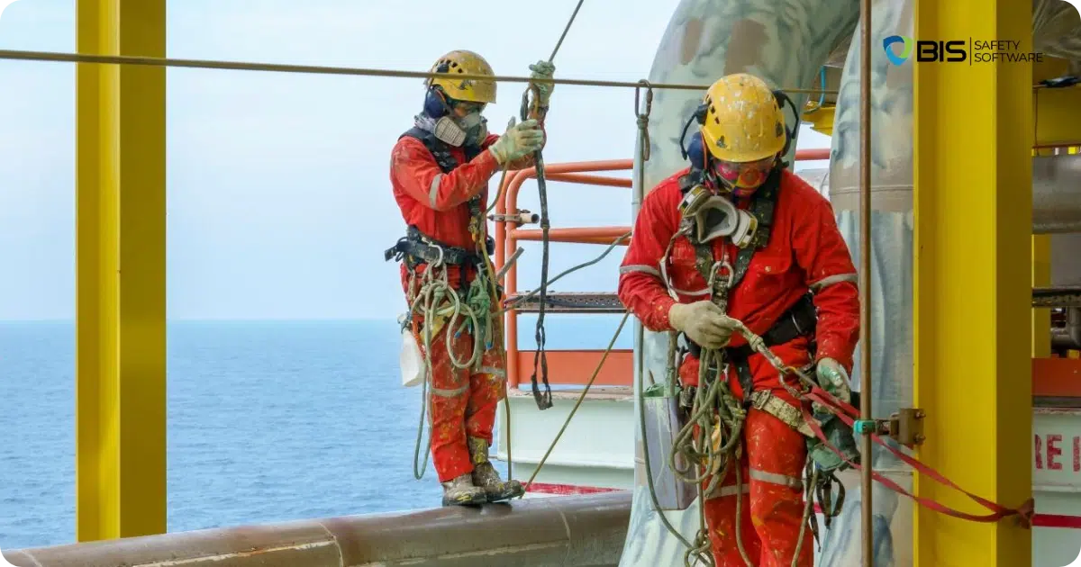 Workers in harnesses on offshore rig