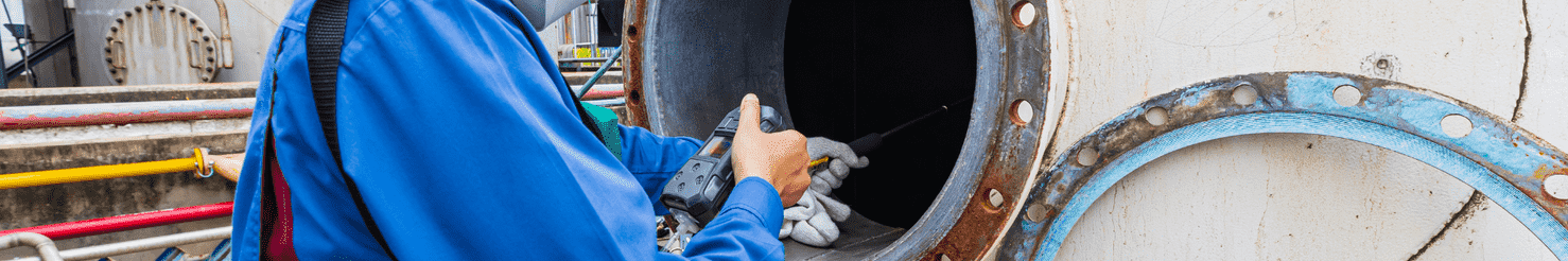 Worker female hand holding gas detector inspection safety gas testing at front manhole tank chemical