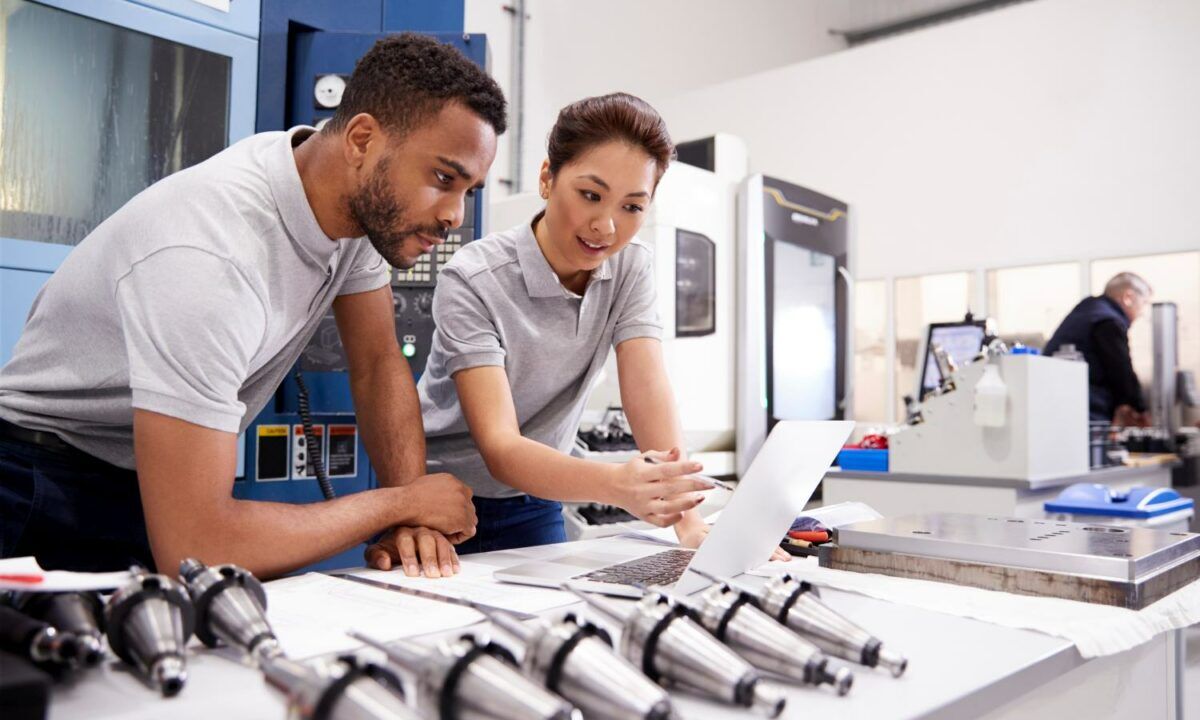 Two Engineers Using EHS management Software On Laptop