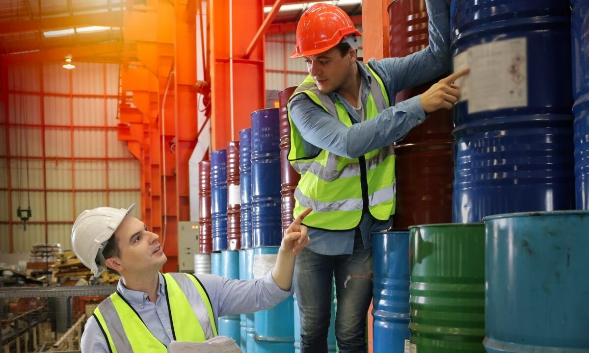 The Caucasian engineer talking and discussing in production line about safety data sheets