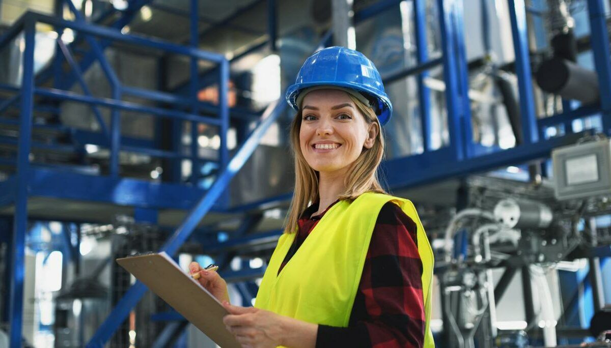 Portrait of female engineer working in industrial factory, doing COR audits