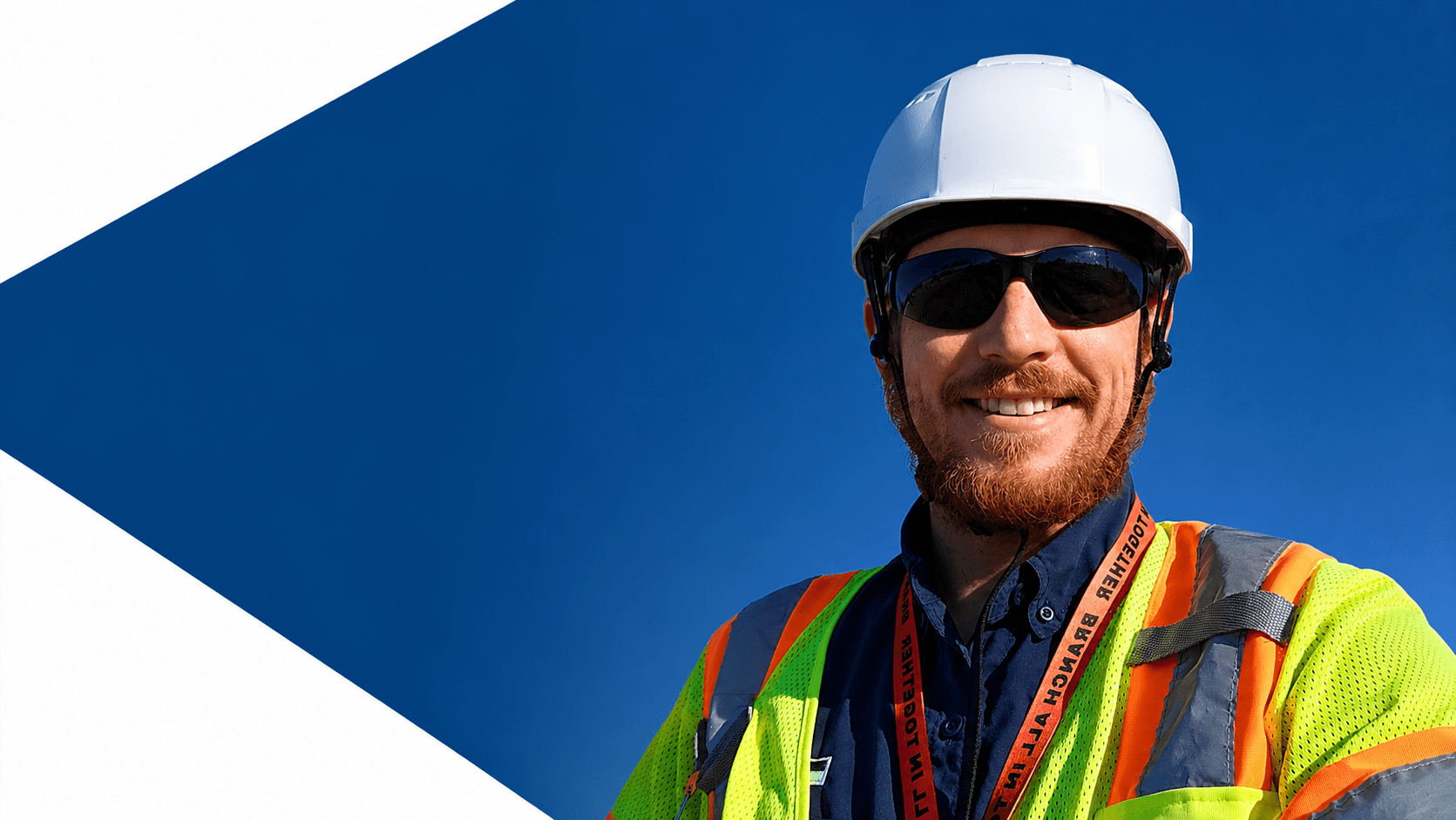 Construction safety manager speaking with workers about building a stronger job site safety culture.